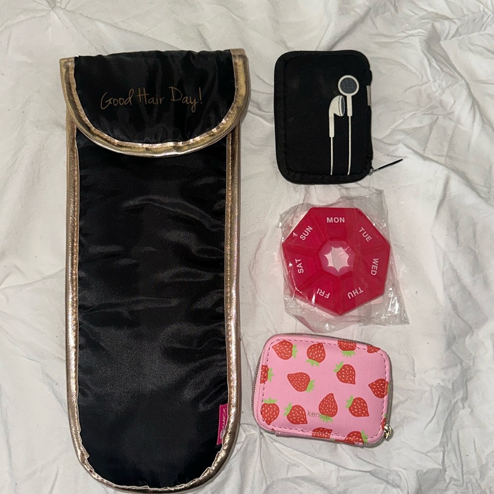 Travel essentials. 2 pill organizers, earphone case, thermal flat iron case